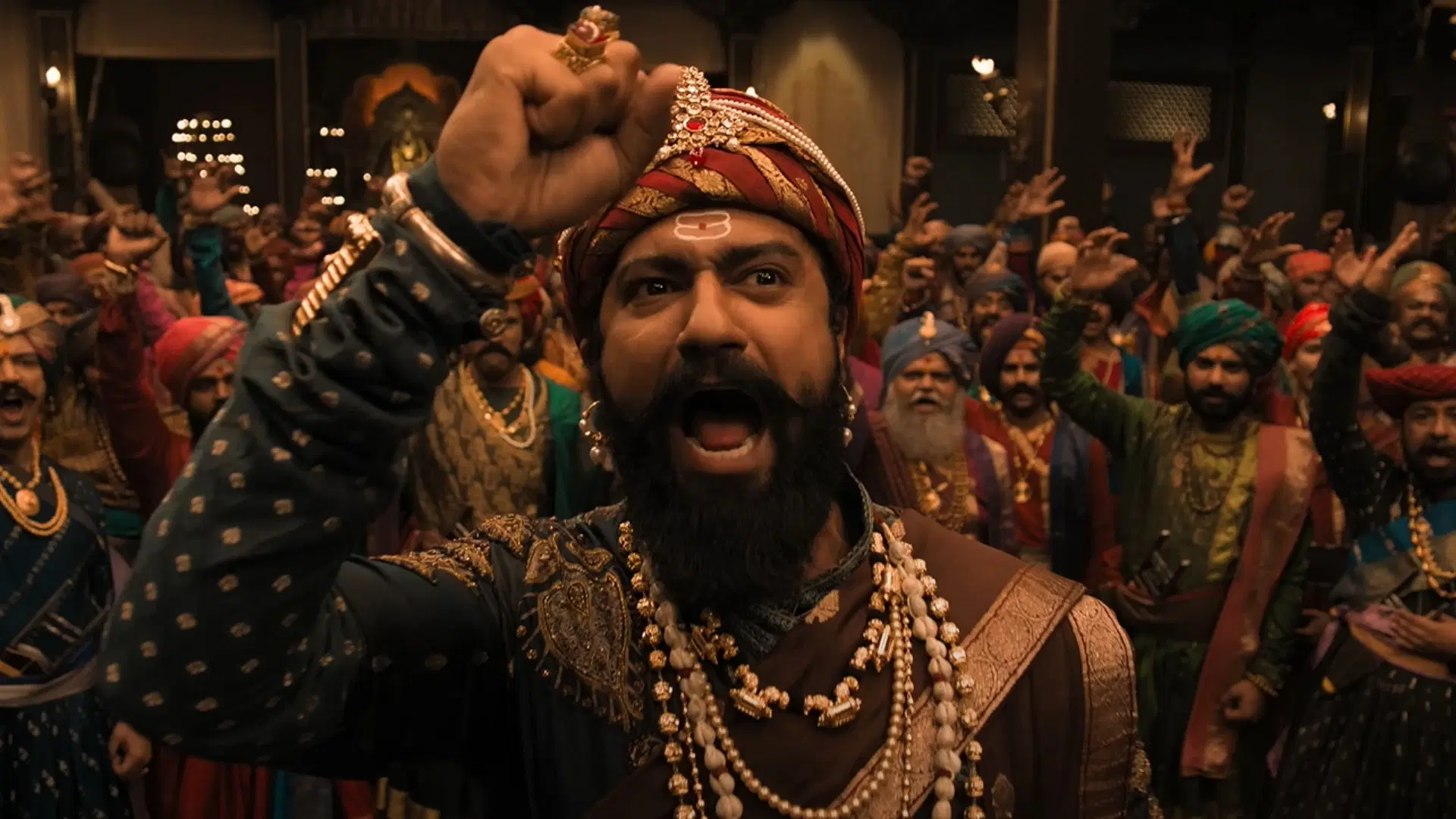 Chhava Movie Review: A Glorious Tribute to Courage & Legacy 3 a man with a beard wearing a turban and holding his fist up