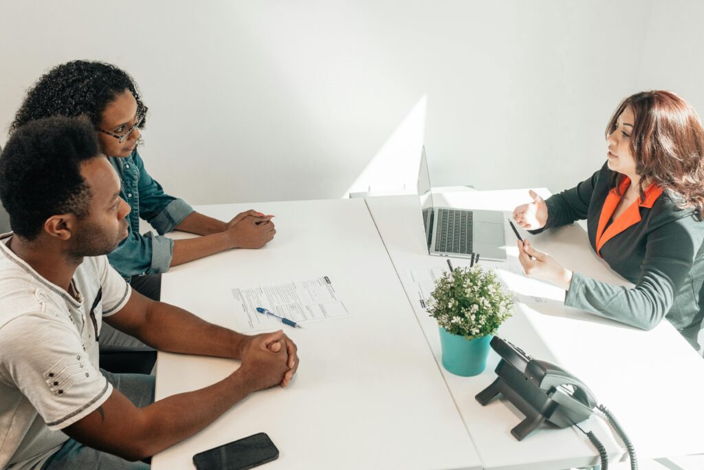 How to Choose the Right Plant for Office Space: A Comprehensive Guide 5 Two adults consulting a legal advisor in a modern office setting.